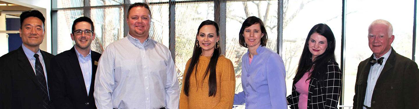 faculty and students at an MBA event in discovery hall